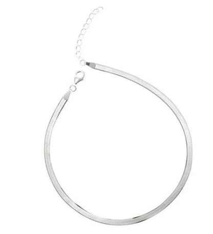 S925 silver snake bone chain anklet in silver and gold finishes, showcasing unique design and craftsmanship.