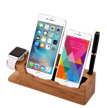 Carbonized bamboo dual phone and watch holder on a desk