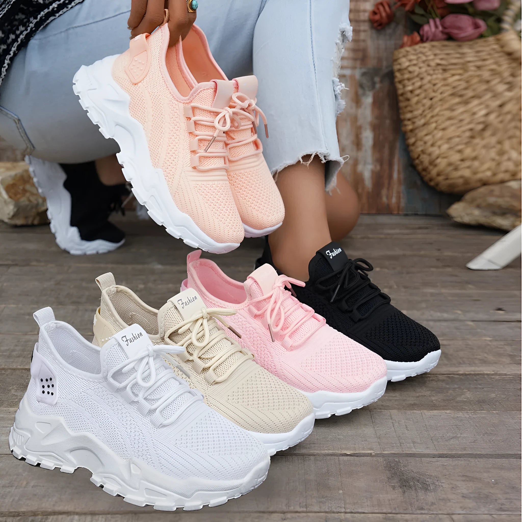 Women's white Flyknit mesh casual sports shoes with flat heel and lace-up front on a neutral background.