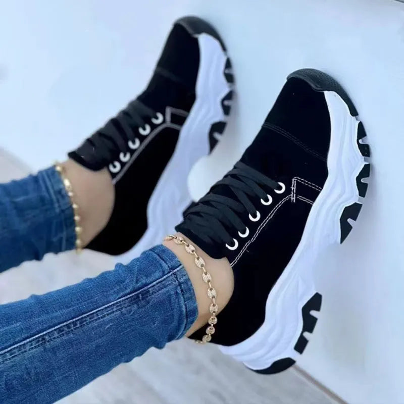 Women's platform lace-up sneaker with rubber sole, round toe, and thick platform in solid red colour