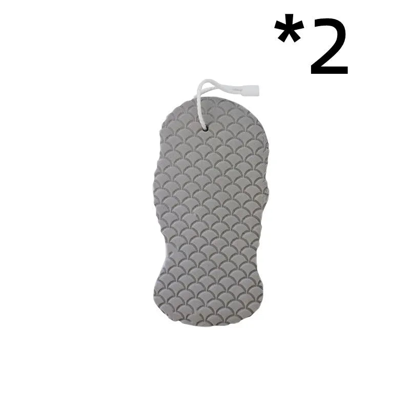 White 3D fish scale pattern bath sponge ball on a bathroom surface.