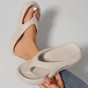 Women's black thick-soled EVA flip-flops with a non-slip patterned sole.
