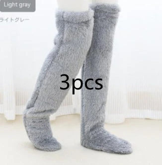 Cozy over-the-knee fuzzy socks in various colors, designed to keep your legs and knees warm during the winter season.