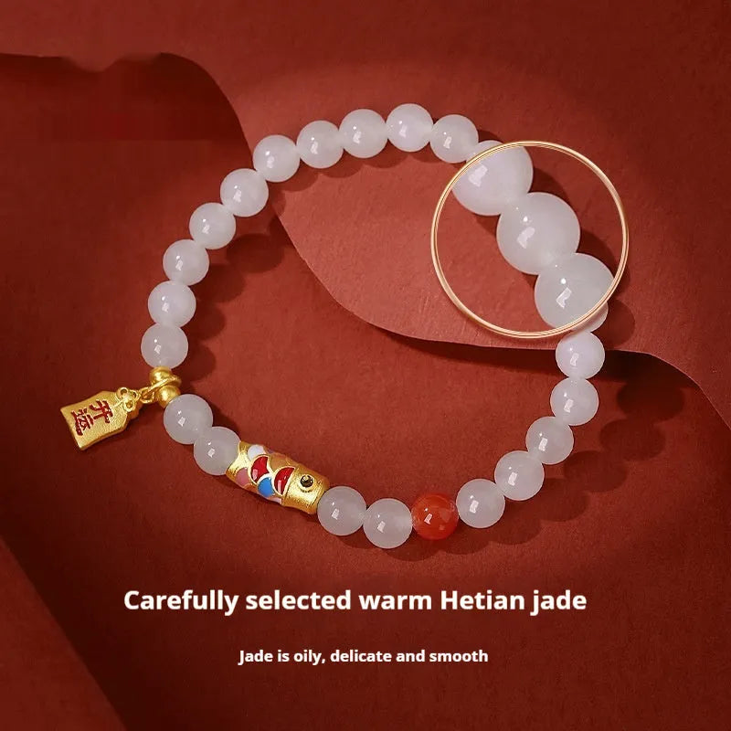 S925 sterling silver bracelet with a cold enamel crafted koi and natural Hetian jade element.