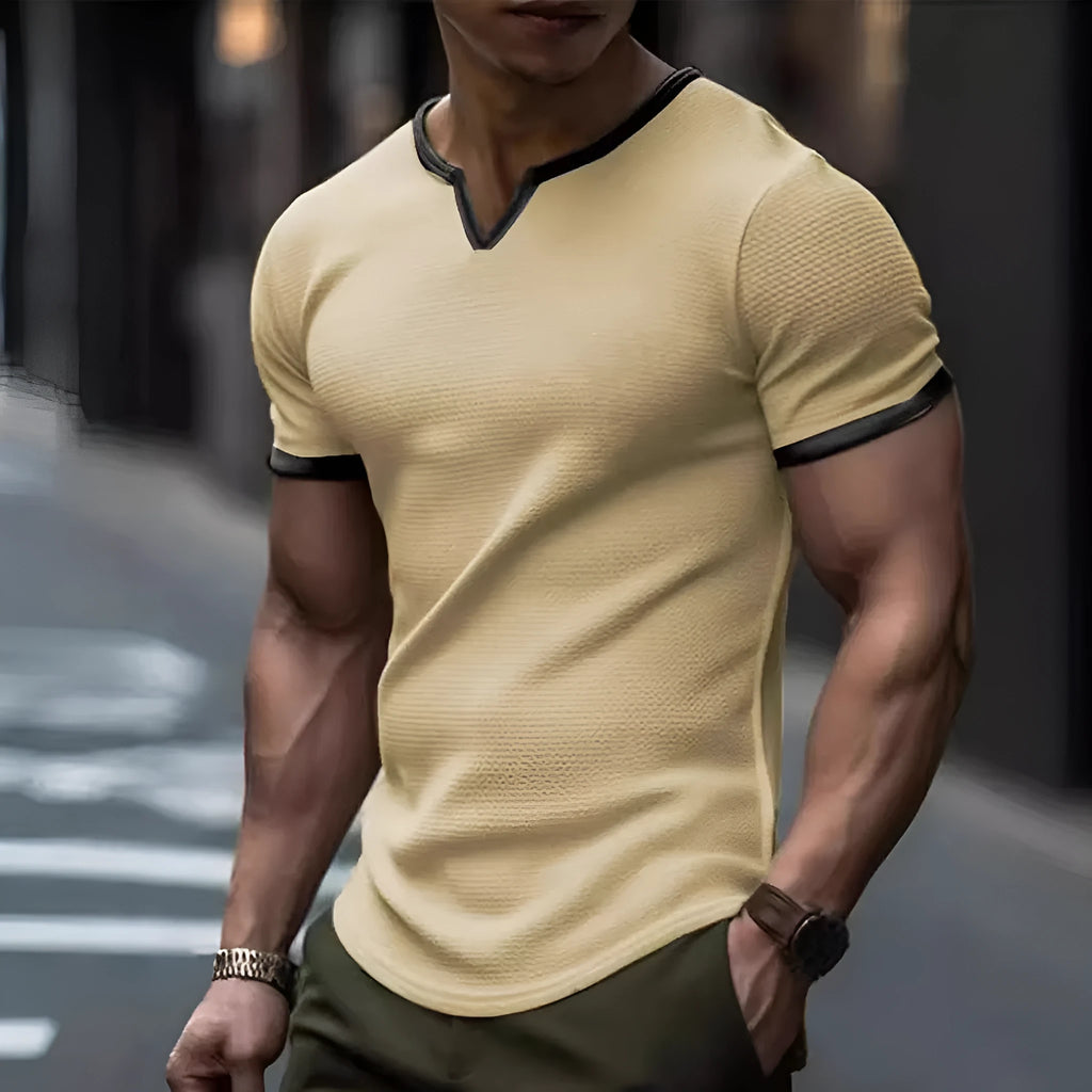 Colour-block V-neck sports t-shirt in waffle-knit polyester fabric on a hanger.