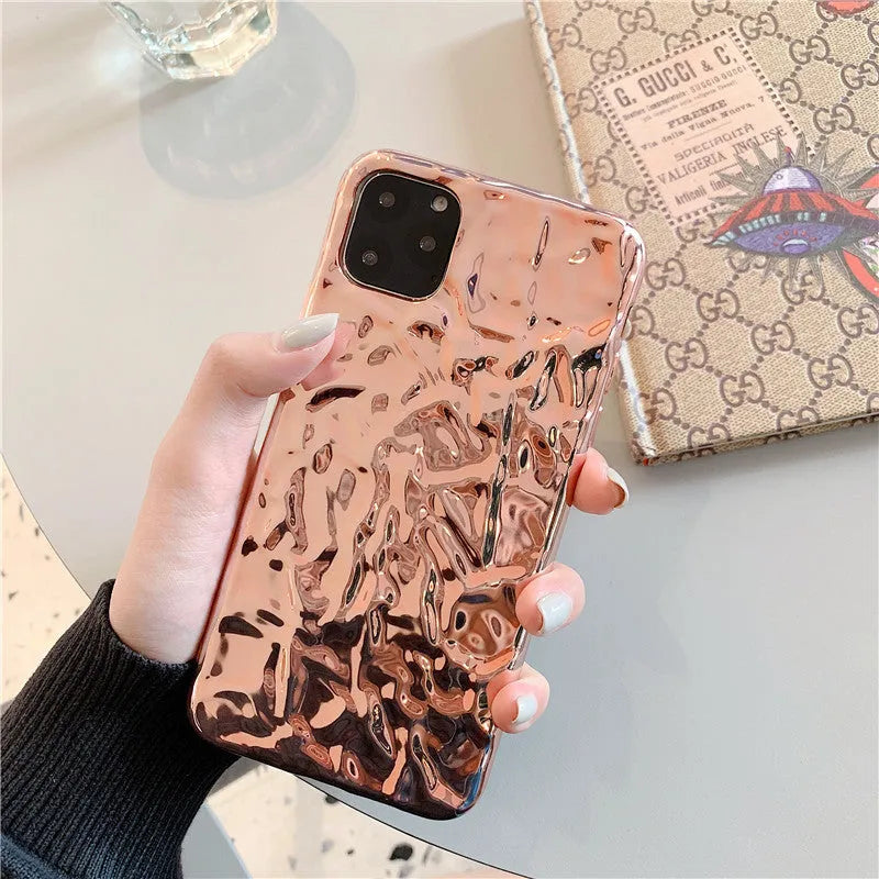 Clear electroplated rose gold iPhone back cover case on an iPhone 15 Pro Max.