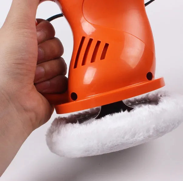 Black 12V car waxing glaze polishing machine with orange switch handle on white background