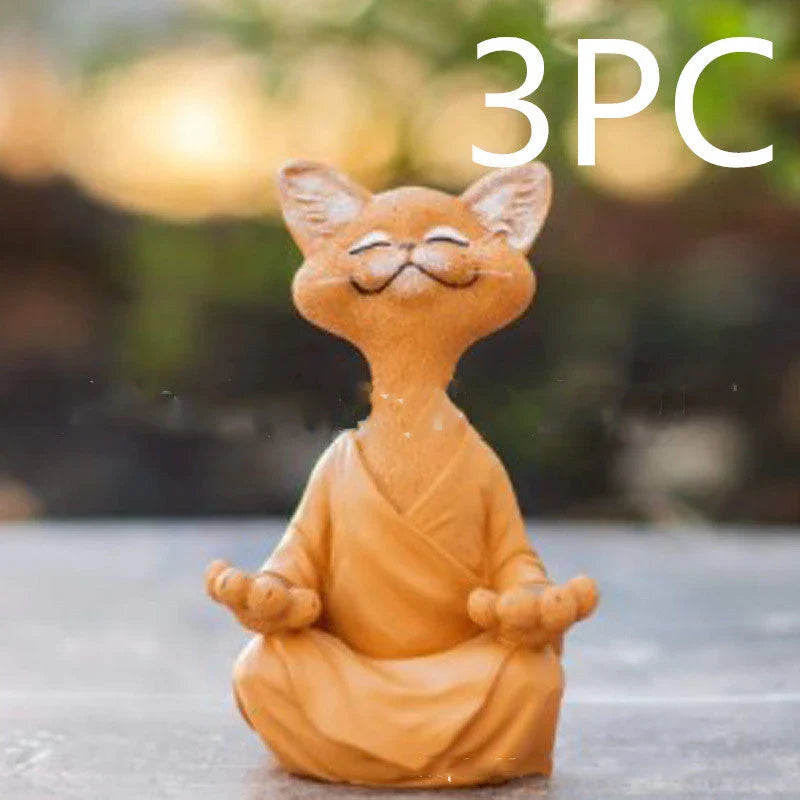 Charming ceramic Buddha cat figurine in black, grey, and orange colors for meditation, yoga, and home decor