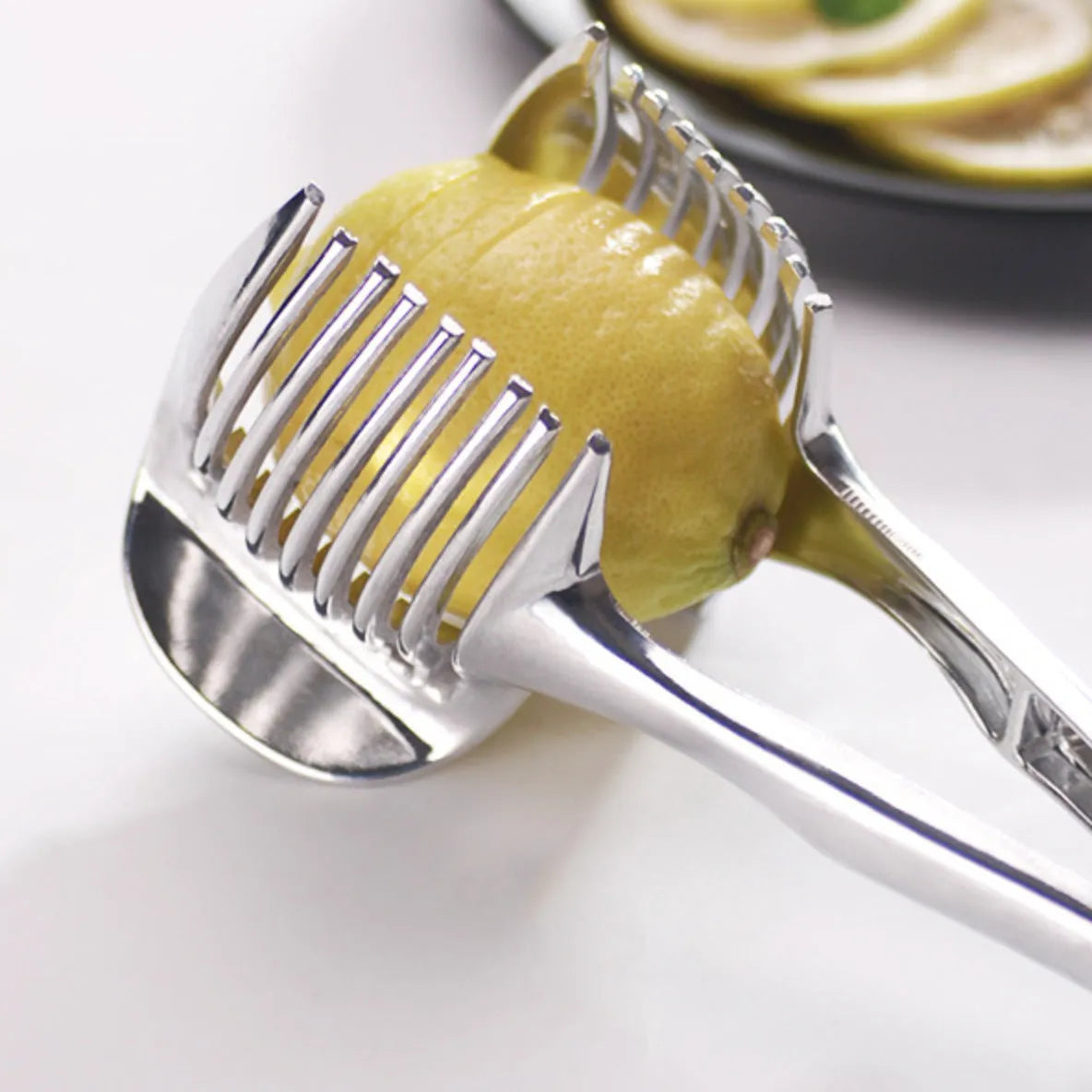 Silver foldable lemon slicer kitchen tool with stainless steel cutting blades