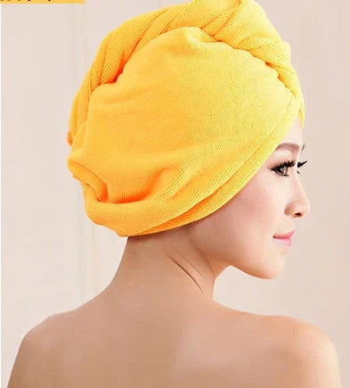 Absorbent microfiber hair turban in various vibrant colours, designed for fast and convenient drying