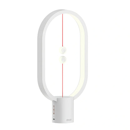 Magnetic bedside night light with ball activation system and adjustable brightness settings