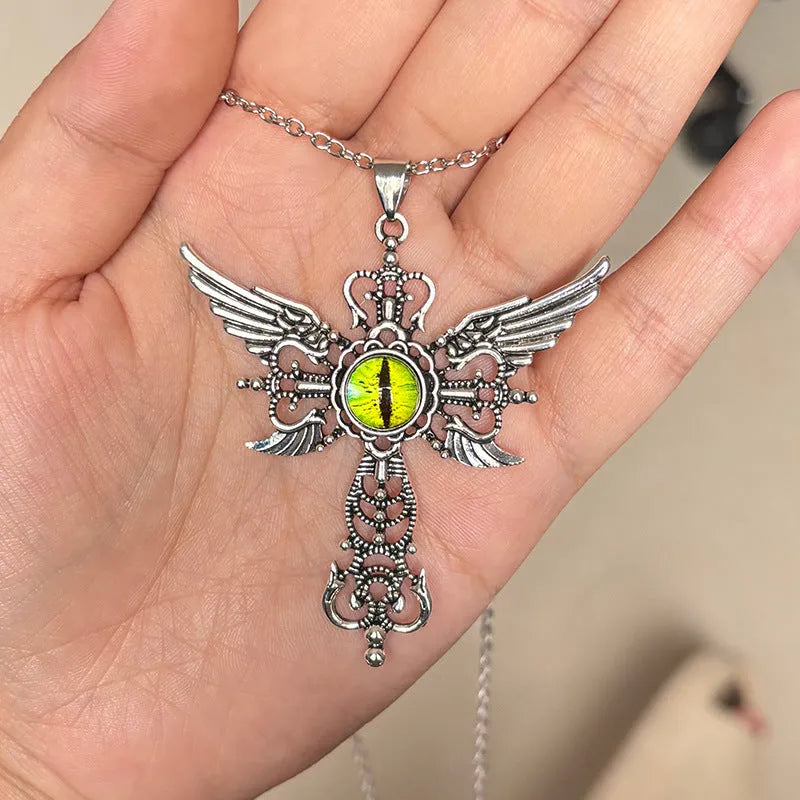 A geometric alloy pendant necklace featuring a cross shape with devil wings, shown in blue, green, purple, red, and yellow colour options.