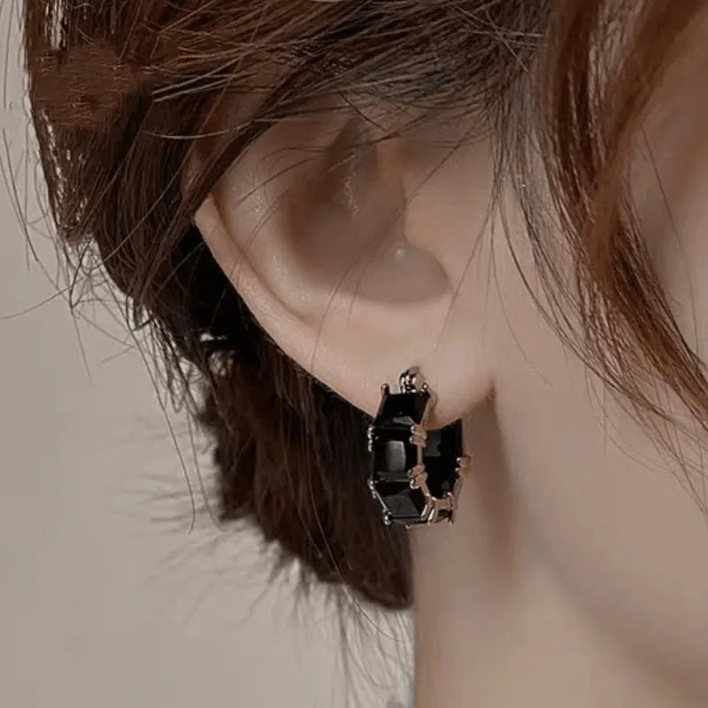 Geometric U-shaped gold electroplated earrings with round black zirconium stones
