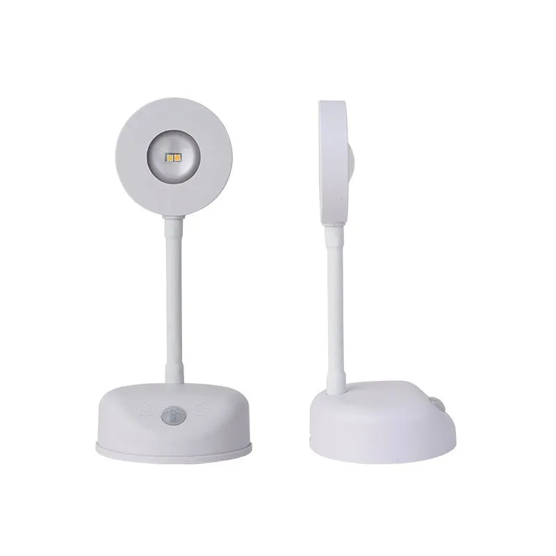 Modern geometric rechargeable wireless wall lamp in white with remote control on a grey wall.