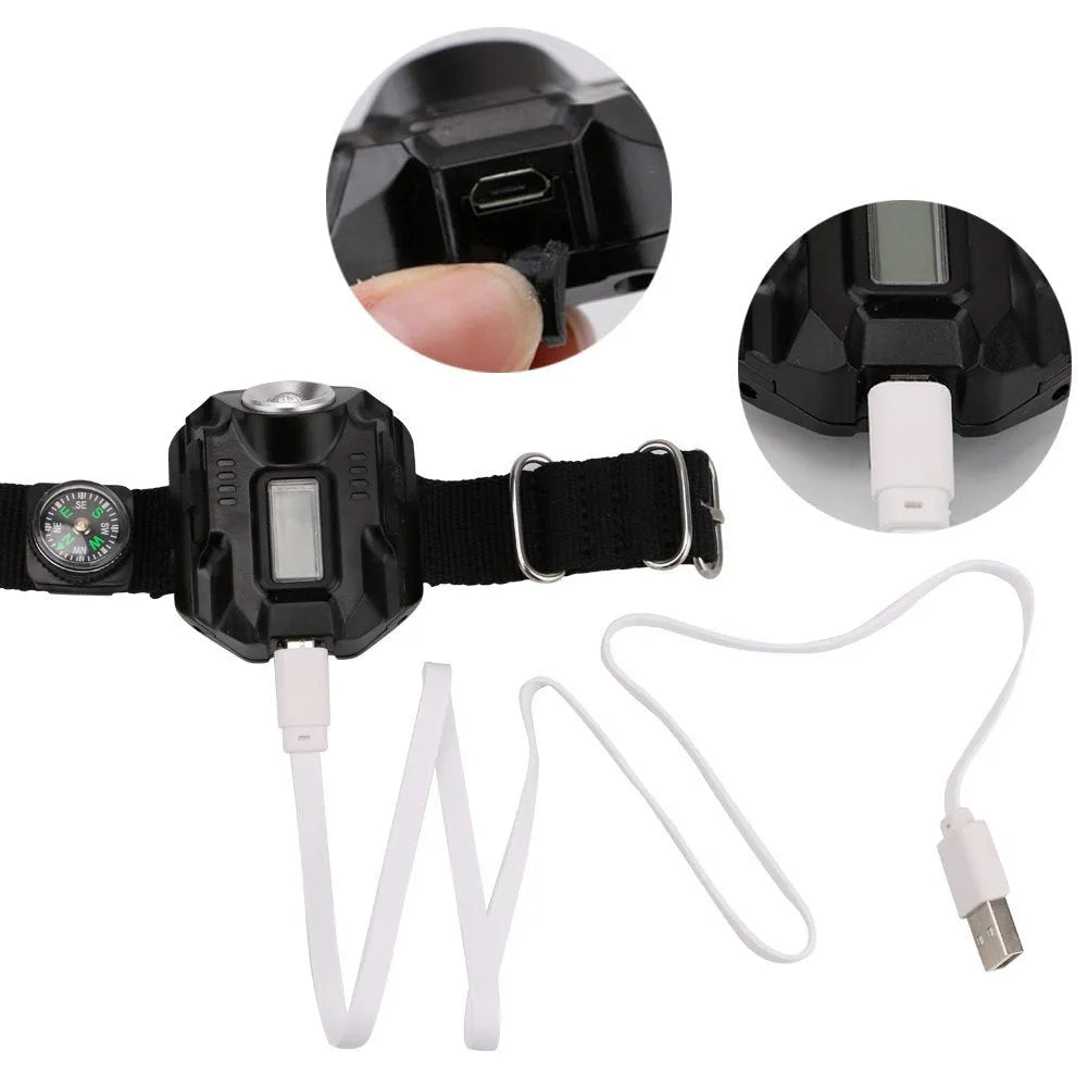 Black LED watch flashlight with time display and compass on wristband for outdoor use
