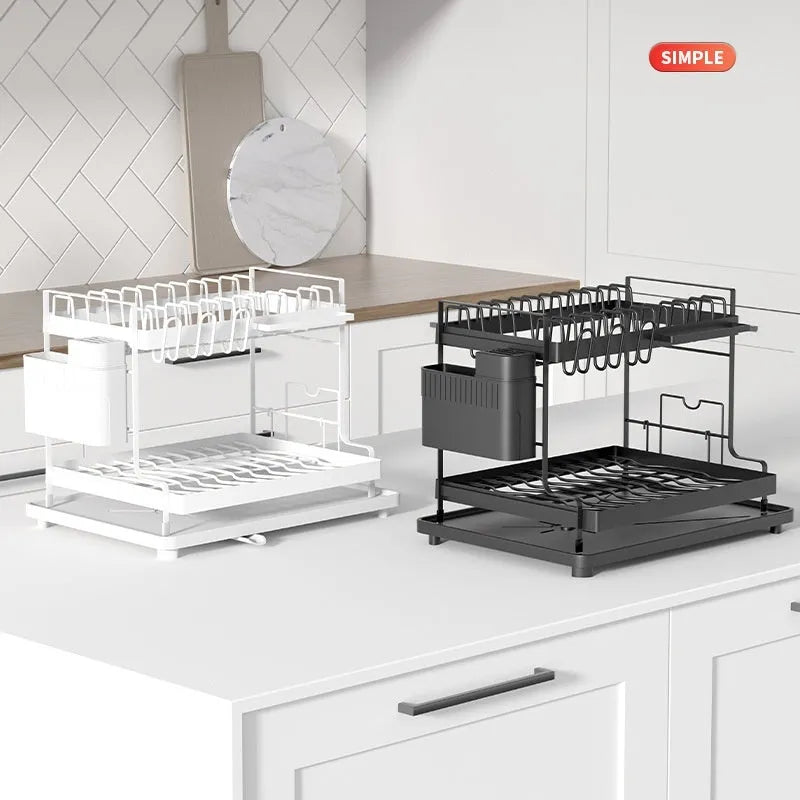 White double-layer metal kitchen draining rack with a removable top tray on a countertop.
