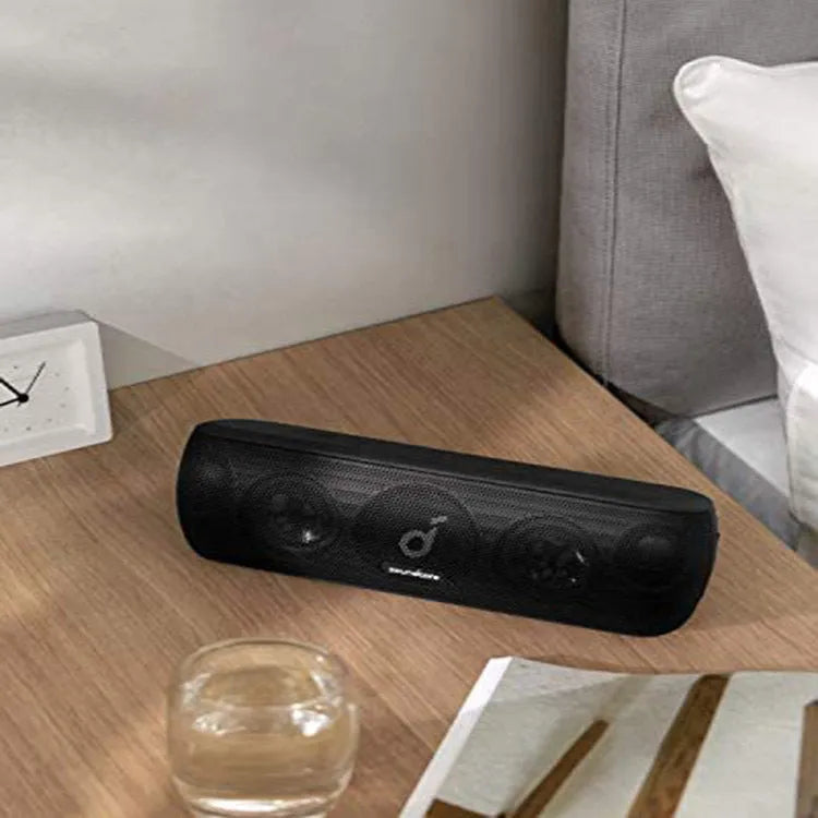 Bluetooth subwoofer speaker in black with front grille and controls