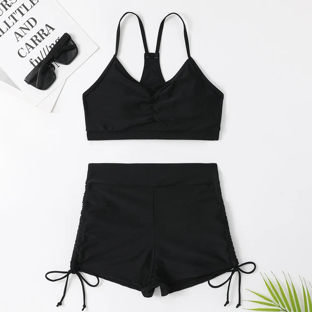Women's high-waisted split bikini swimsuit in black or violet colour.