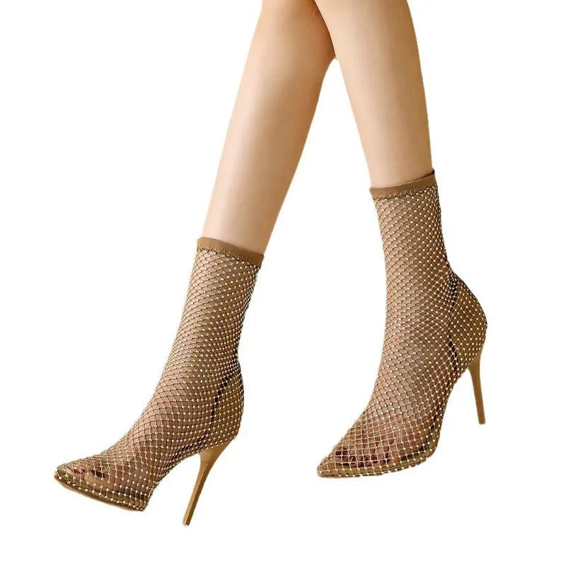 Gold high heel sandals with pointed stiletto design and mesh upper material
