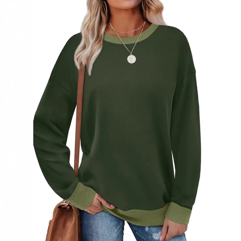 Women's loose round neck striped long sleeve top in apricot colour on a hanger.