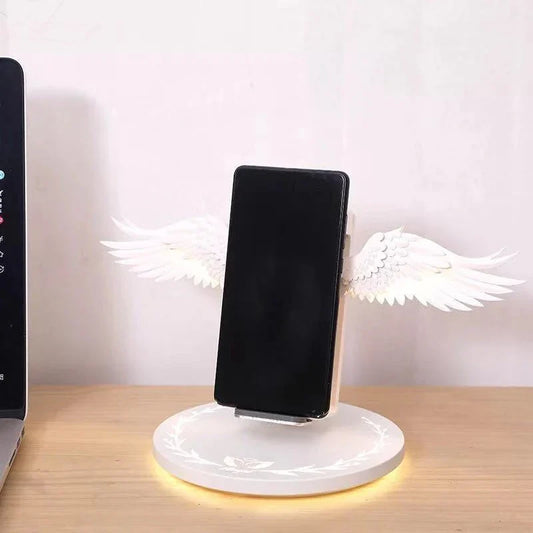 Angel Wings Wireless Charger with unfolding wings and aura base for fast 15W charging
