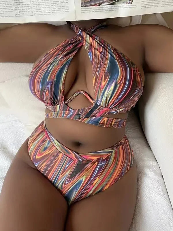 Women's floral print high-waisted bikini swimsuit with split sides.
