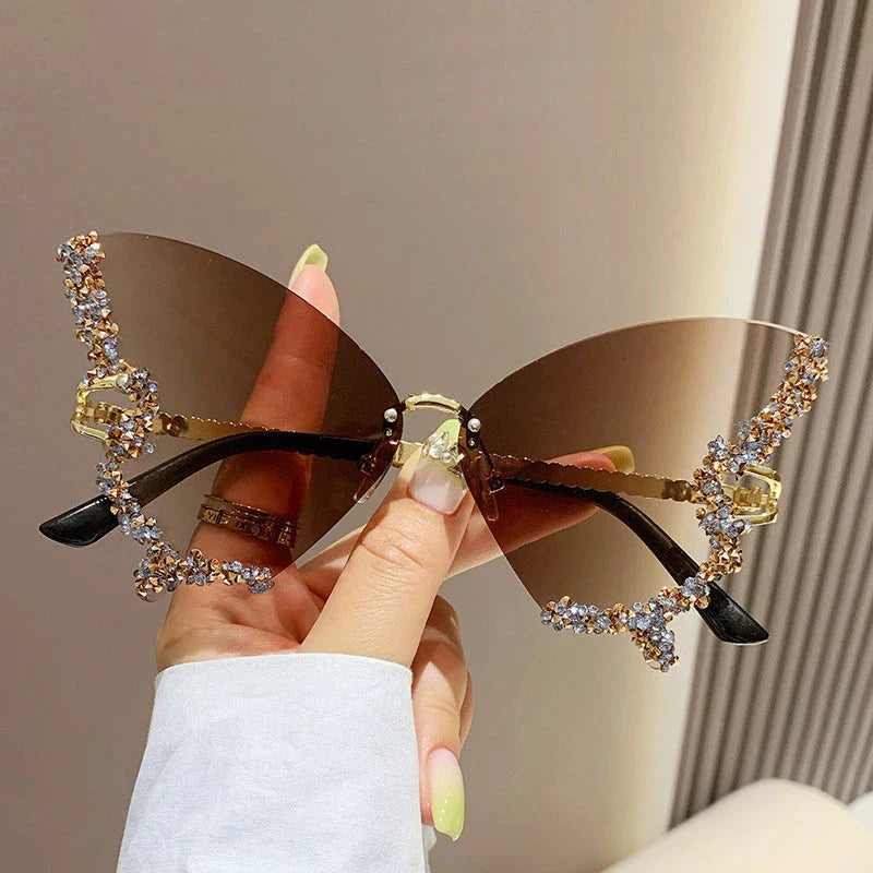 Luxury diamond-studded butterfly sunglasses in various gradient color options, featuring a vintage-inspired design and high-quality materials for a fashionable and glamorous look.