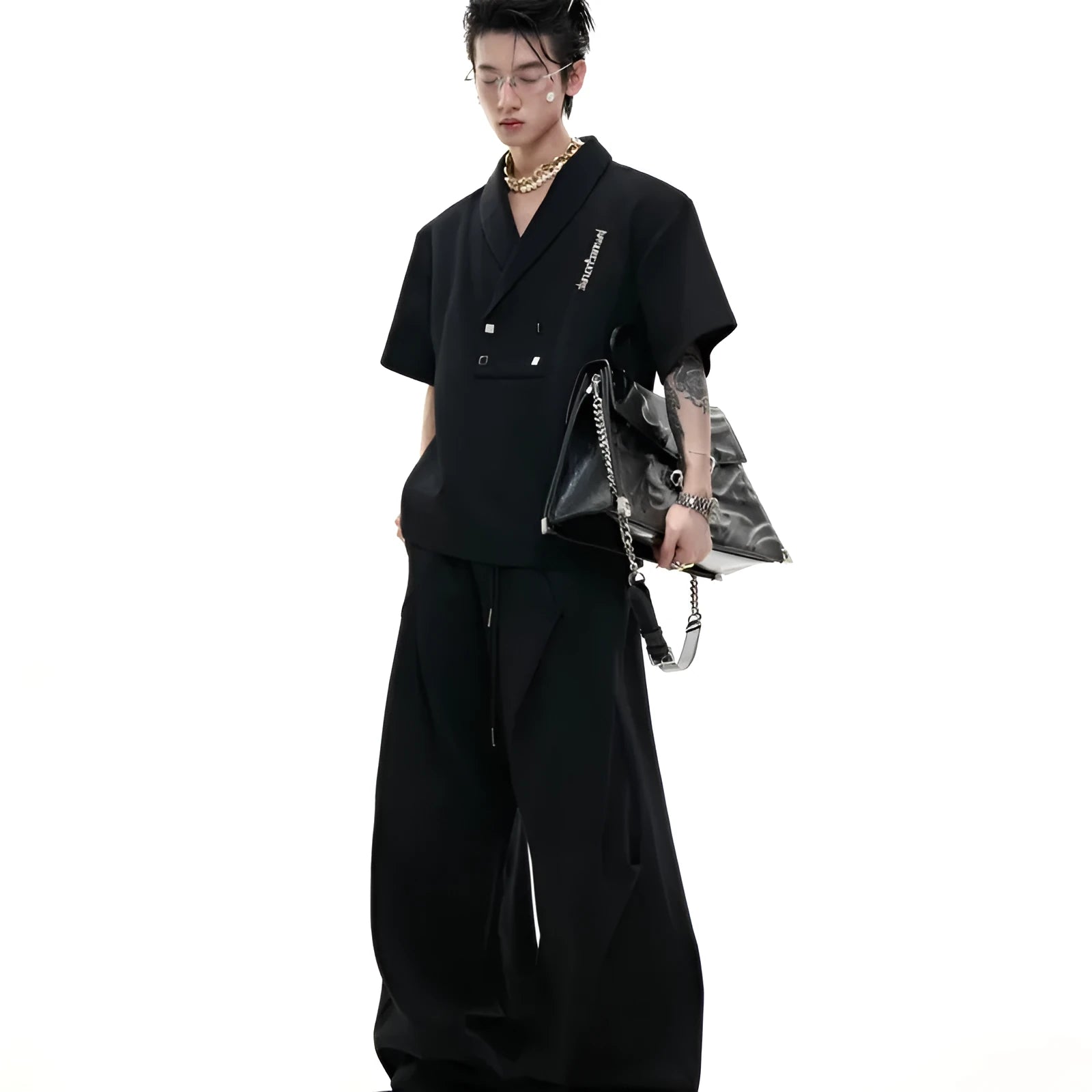 Men's dark grey V-neck cotton sports suit with padded shoulder jacket and matching shorts.
