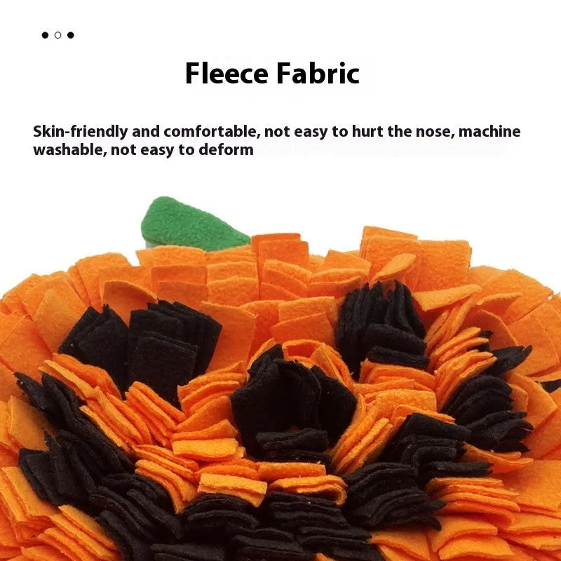 Orange pumpkin-shaped dog slow feeder mat with fleece texture on wooden floor