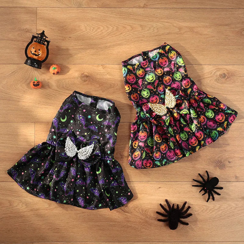 Orange Halloween dog costume with angel wings and a halo, featuring a bright pumpkin print design.