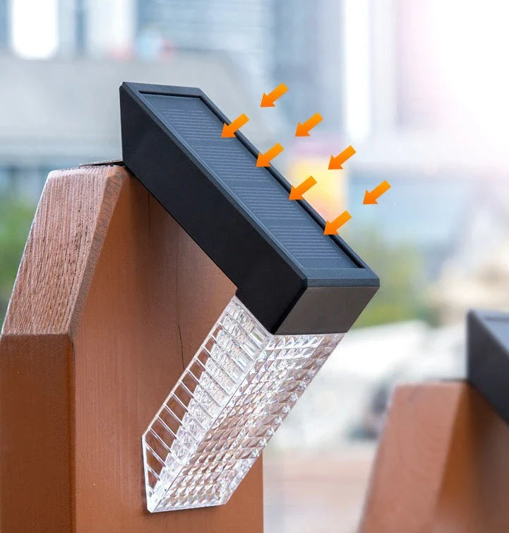 Solar-powered stair lights illuminating a wooden deck in a backyard garden setting