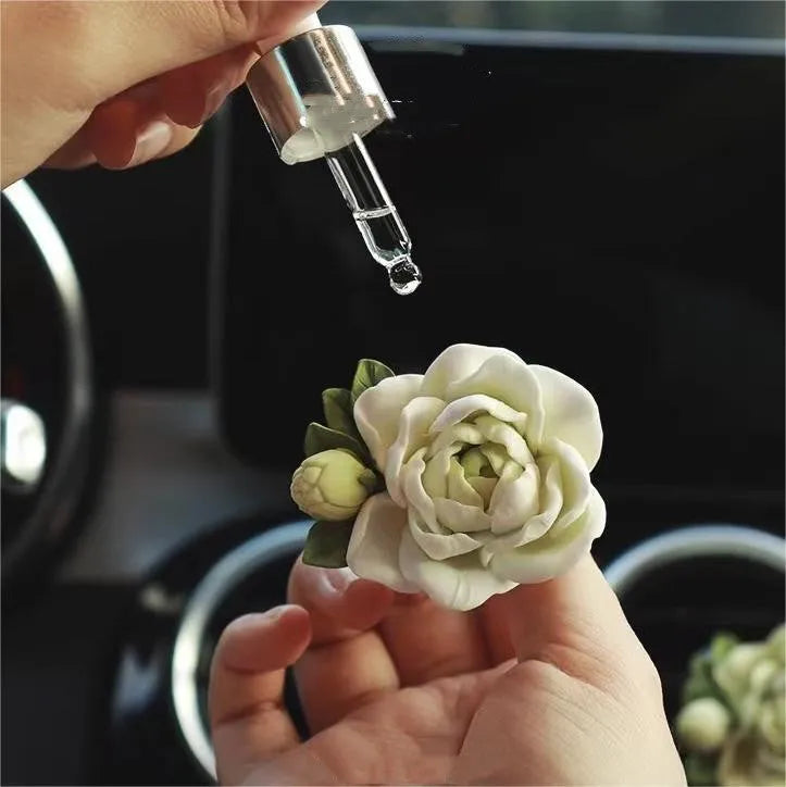 Gypsum solid car air freshener with jasmine oil clipped to vehicle vent