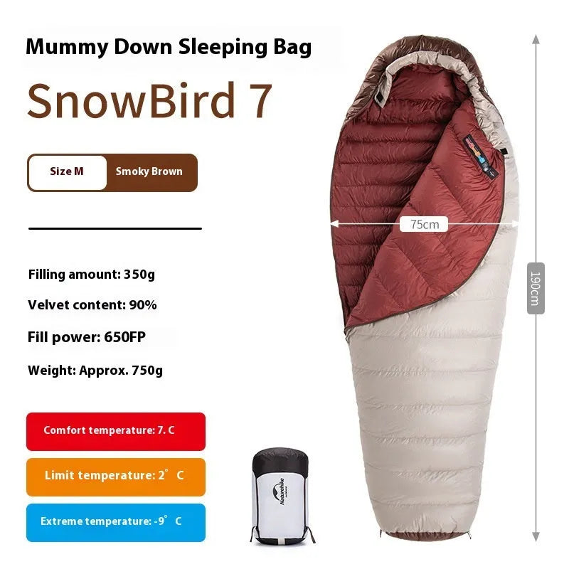 Goose down mummy sleeping bag shown with its compression storage bag.