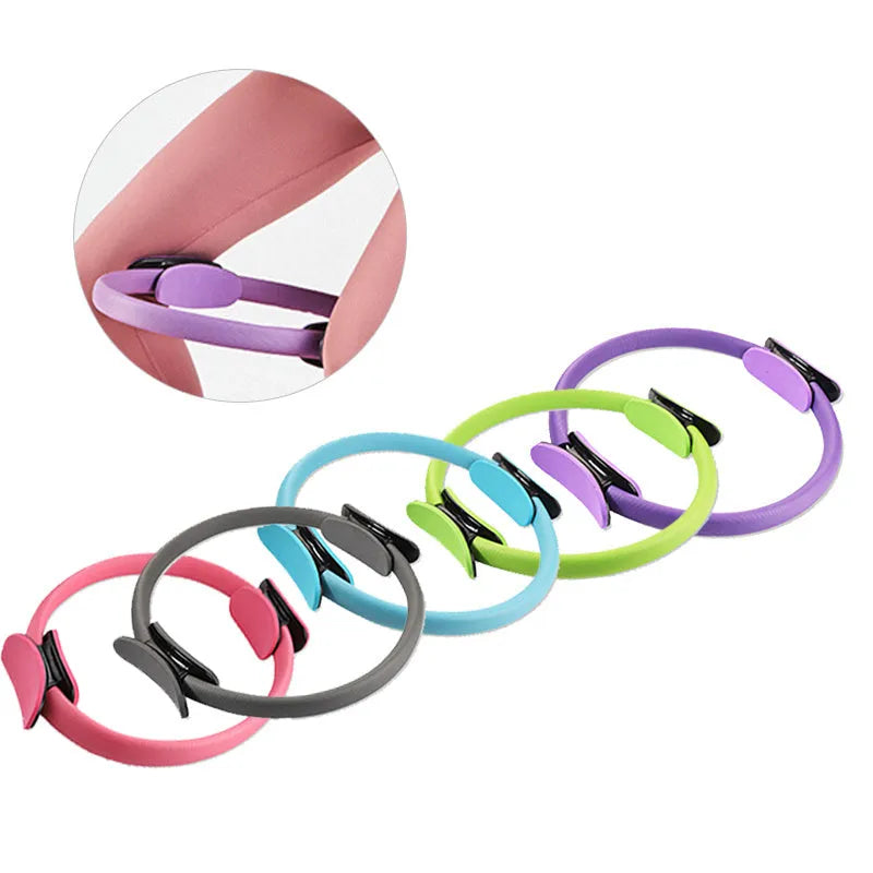 Pink Pilates ring with ergonomic curve on floor for core strength and posture exercises