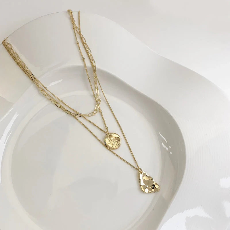 Multi-layer unisex clavicle chain with geometric triangle pendant and snake bones chain