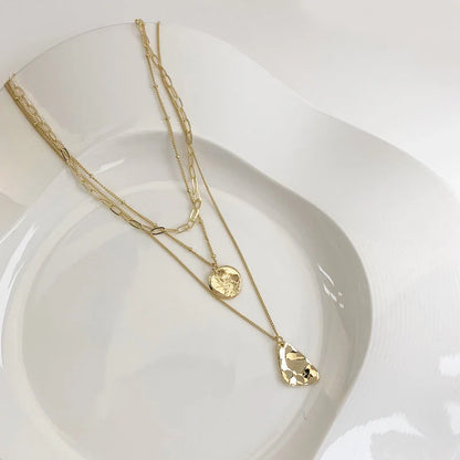 Multi-layer unisex clavicle chain with geometric triangle pendant and snake bones chain