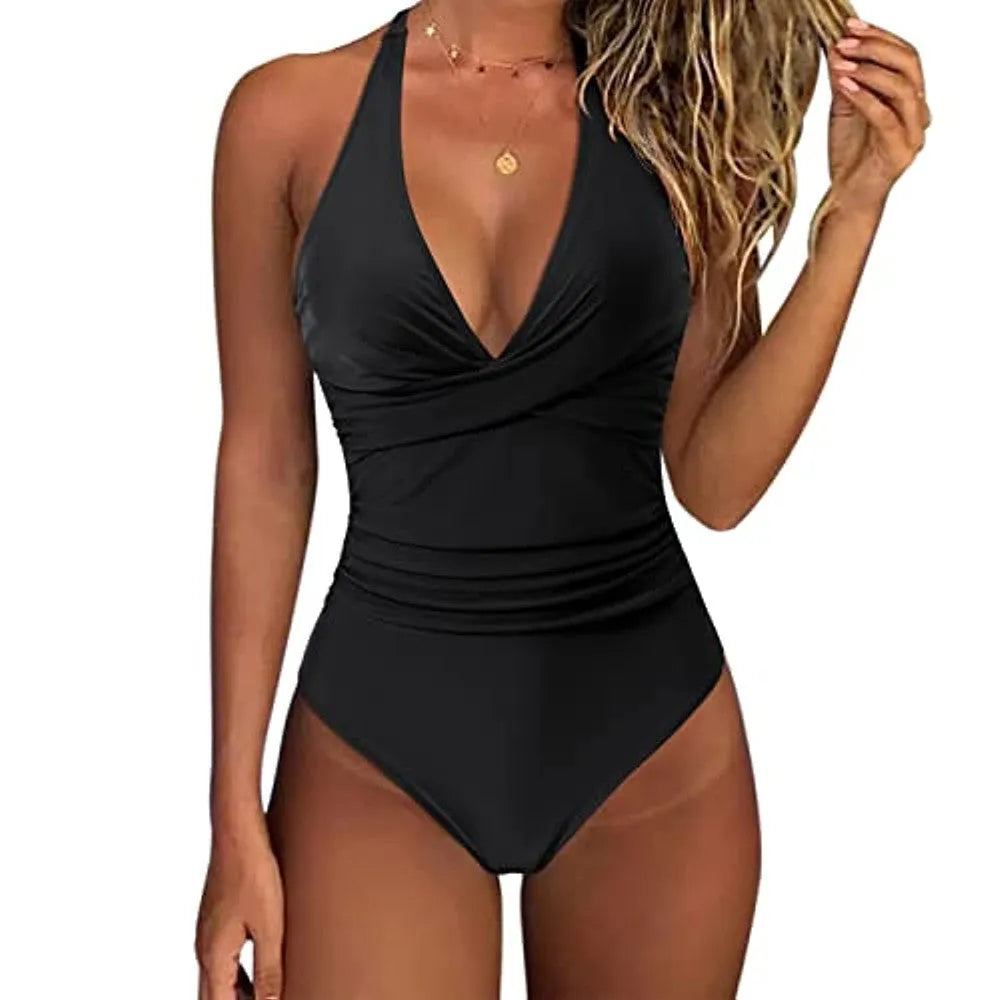 Women's black cross-front one-piece swimsuit laid flat, showing Asian size label.