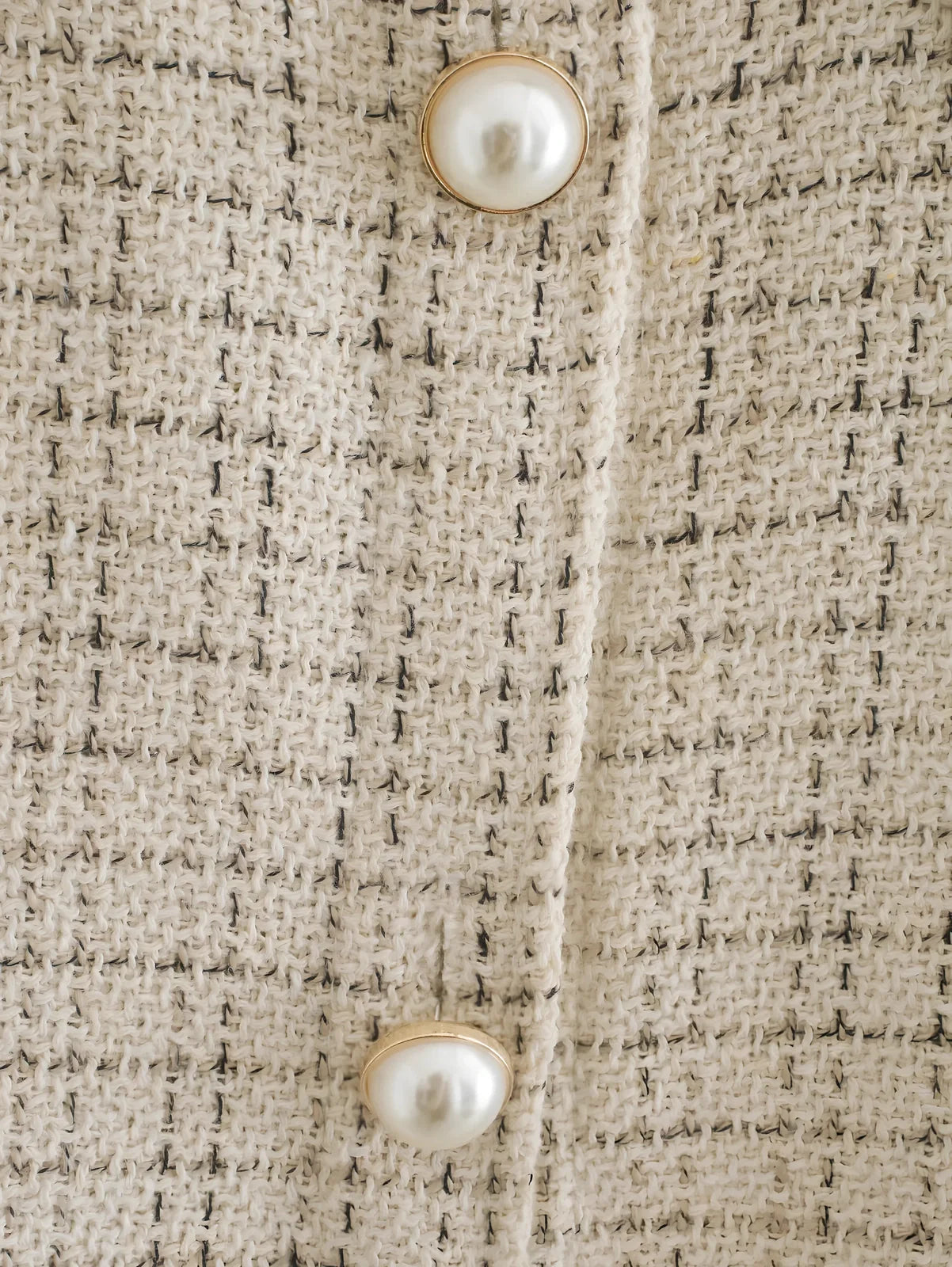 Women's beige plaid thick coat with pearl buttons, long sleeves, lapel collar, and side pockets in size M