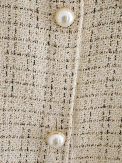 Women's beige plaid thick coat with pearl buttons, long sleeves, lapel collar, and side pockets in size M