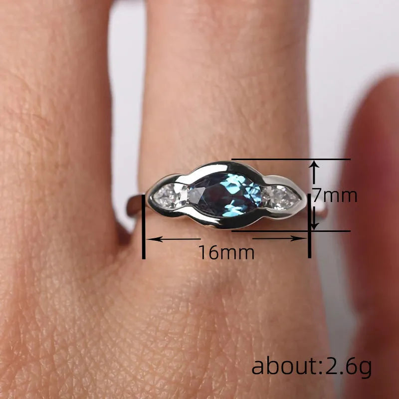 Women's geometric ellipse ring with zircon stone in white gold colour finish on model finger