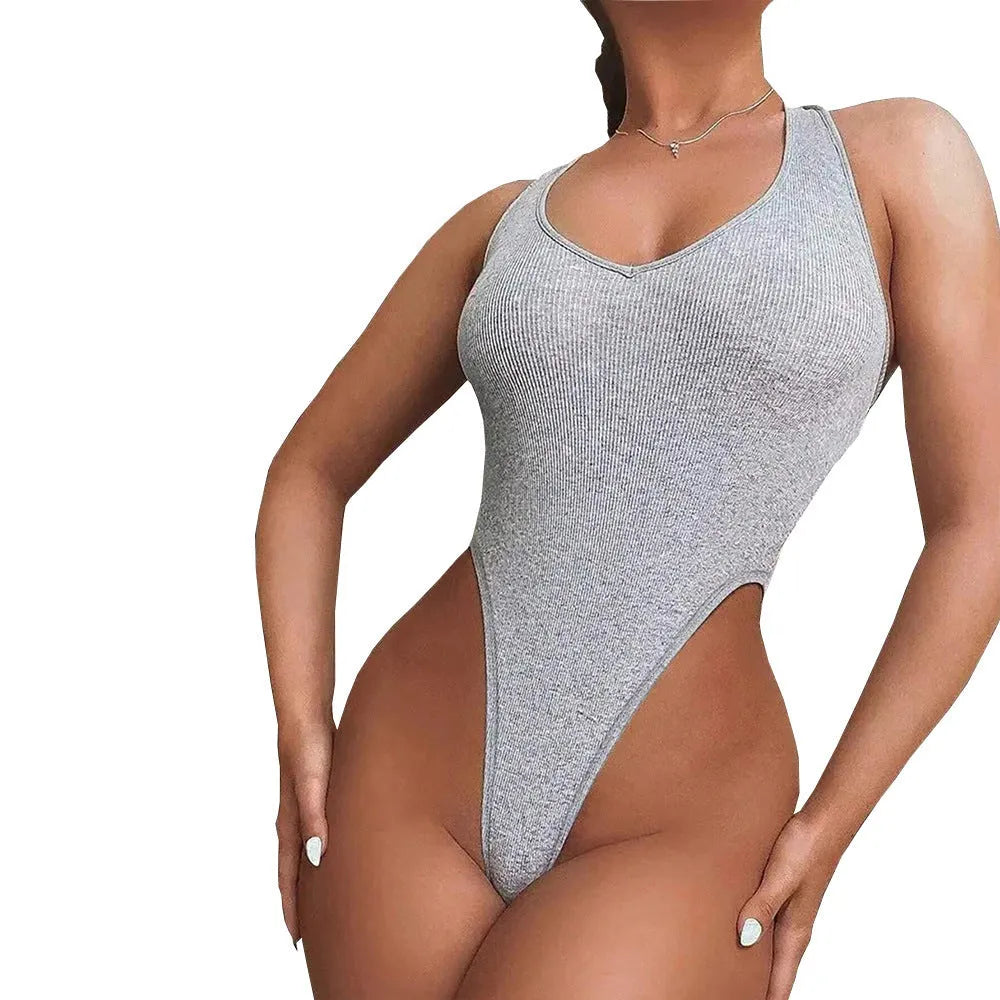 Grey women's halter neck jumpsuit with suspender straps and high-waist shorts.