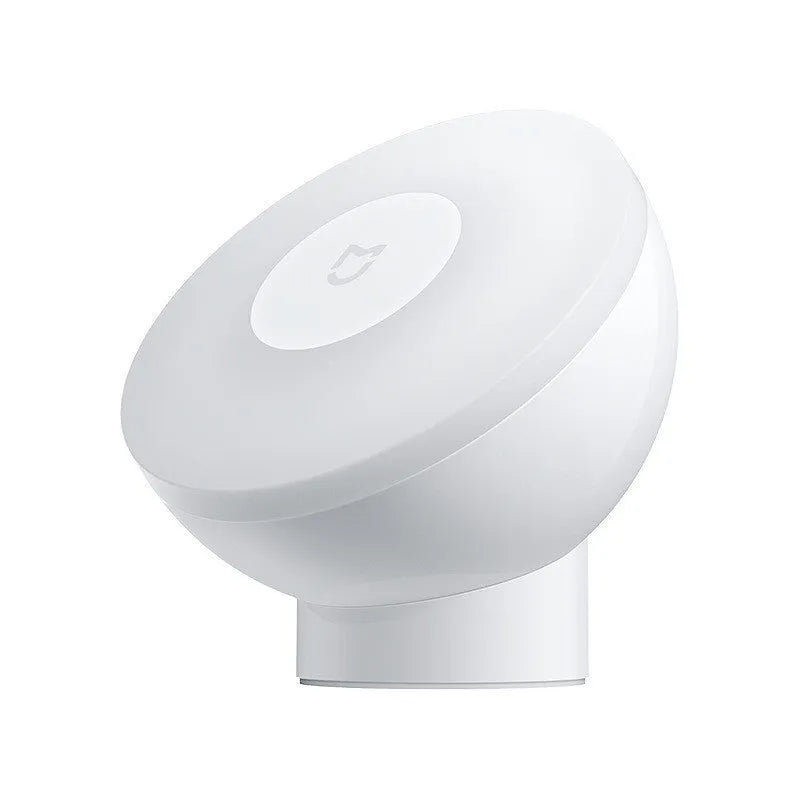 White modern bedside table lamp with human body induction and Bluetooth connectivity.