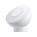 White modern bedside table lamp with human body induction and Bluetooth connectivity.