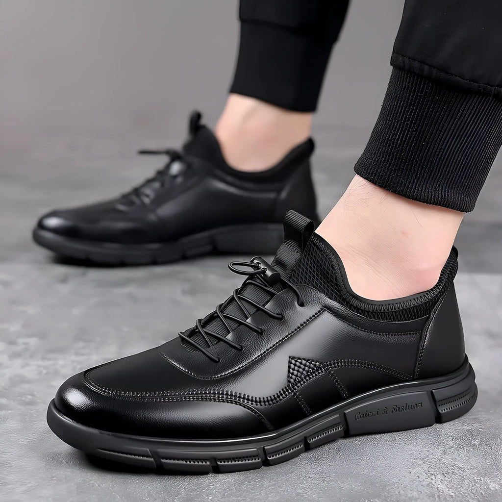 Black men's casual leather shoes with a round toe, square low heel, and a stitched leather upper on a rubber sole.