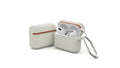 Beige silicone clamshell case for Apple AirPods with a metal buckle fastened.