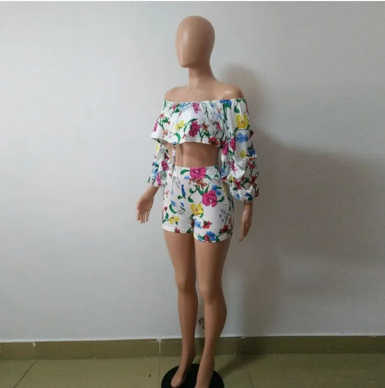Women's multicolour digital print two-piece playsuit with fluffy pile sleeves and matching shorts.