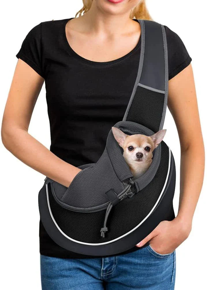 Stylish pet carrier bag with adjustable drawstring closure, breathable design, and zippered bottom for secure pet transport