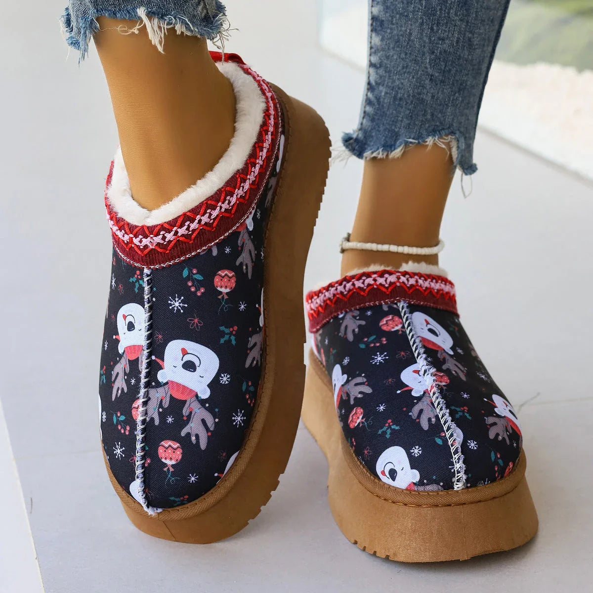 Women's festive plush-lined winter ankle boots with Christmas print, perfect for adding warmth and style to your winter wardrobe.