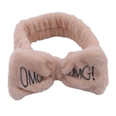 Coral velvet butterfly end hair band in pink with text styling, showing butterfly ends and cloth material