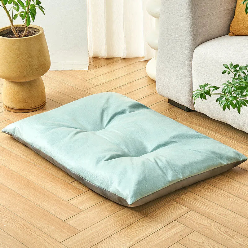Blue pet bed sleeping mat for cats and small dogs in a nest style with raised edges.